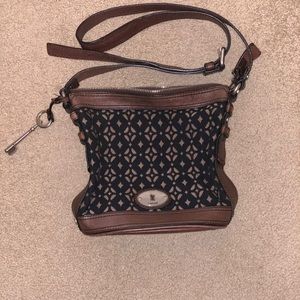 Fossil medium sized brown leather with black fabric crossbody bag.